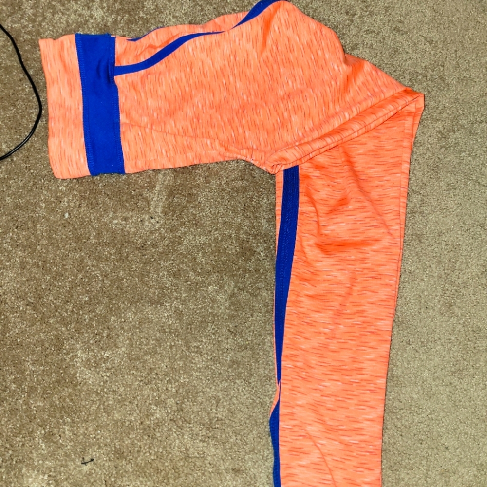 Orange leggings with blue stripes